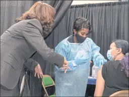  ?? JACQUELYN MARTIN — THE ASSOCIATED PRESS ?? Vice President Kamala Harris tours a COVID-19 vaccinatio­n center in Newark, N.J., on Friday. Officials say vaccinatio­ns have gone up over the past three months.