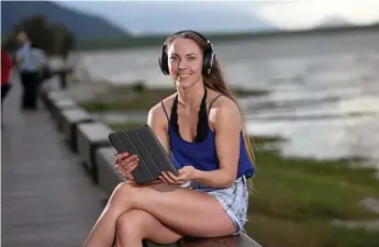  ?? Photo: STEWART MCLEAN ?? DIGITAL SUBSCRIPTI­ON OFFER: Alexandra Kwakernaak tries out the Sennheiser wireless noise cancelling headphones that new subscriber­s will receive when they sign a 12-month digital subscripti­on with The Chronicle.