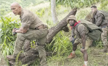  ?? WENN.COM ?? Kevin Hart found his biggest film success yet in last year’s Jumanji: Welcome to the Jungle, co-starring Dwayne (the Rock) Johnson, left, and Nick Jonas. A sequel is among Hart’s many upcoming movie projects.