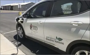  ?? IVP FILE PHOTO ?? One of the electric vehicles currently in Imperial Irrigation District’s fleet sit at a charging station in this June 30, 2020, photo.