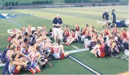  ?? COURTESY PHOTO ?? Steve Willett speaks to players from the Crosse Over program following a game that was part of the exchange program with the Stockport Metros.