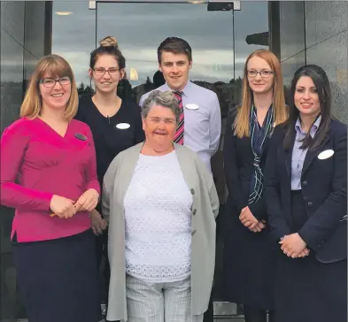  ??  ?? Moira Thomson with some of the Specsavers’ staff who will also be abseiling from the Cruachan Dam.