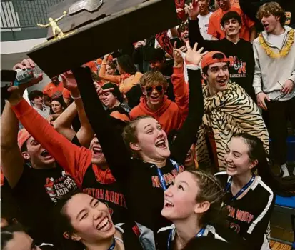  ?? MARK STOCKWELL FOR THE GLOBE ?? It was jubilation for the Tigers of Newton North after capturing the Division 1 state crown.