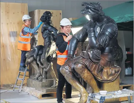  ??  ?? FINISHING TOUCHES: Ellie King, left , at work on the statue of Laocoon and Csilla Karsay, working on the statue of Lorenzo de Medici by Michelange­lo.