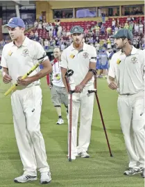  ??  ?? ADELAIDE: This photo taken on November 29, 2015 shows Australia’s pace spearhead Mitchell Starc (C) walking onto the field with crutches at theend of first day-night cricket Test match against New Zealand at the Adelaide Oval. Mitchell Starc said...