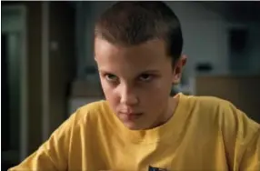  ?? NETFLIX VIA AP ?? This image released by Netflix shows Millie Bobby Brown in a scene from, “Stranger Things.” Brown portrays Eleven, who can move things with her mind and is the fascinatin­g secret friend of a group of pre-teen boys in the fictional town of Hawkins, Ind.