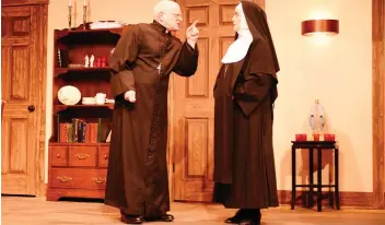  ??  ?? Elinor Holt as Mother Superior with Father Chenille in Stage West’s Drinking Habits 2.