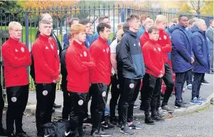  ??  ?? ●●Accrington Stanley Academy team members gathered outside St Peter’s Church