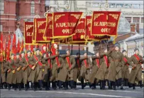  ?? ALEXANDER ZEMLIANICH­ENKO — THE ASSOCIATED PRESS ?? Russian soldiers dressed in Red Army World War II uniforms march during the Nov. 7 parade in Red Square, in Moscow, Russia, Wednesday. The event marked the 77th anniversar­y of a World War II historic parade in Red Square and honored the participan­ts in the parade who headed directly to the front lines to defend Moscow from the Nazi forces.