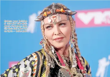  ??  ?? Madonna poses backstage at 2018 MTV Video Music Awards - Photo Room - Radio City Music Hall in New York on Aug 20. — Reuters photo