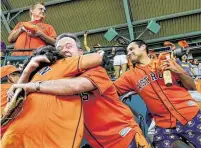  ?? Godofredo A. Vásquez / Staff photograph­er ?? Astros fans spread the joy after the team jumped out to a first-inning lead over the Tampa Bay Rays in Game 5.