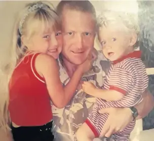  ??  ?? The late Corporal Dewi Pritchard with his two children