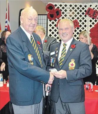  ?? SPECIAL TO THE EXAMINER ?? Royal Canadian Legion Lifetime member Ross Althouse (left) receives his 60 years of Service pin from Branch 300 President Kevin English during the Norwood Legions annual Honour and Awards night held last Saturday.