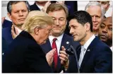  ?? MANUEL BALCE CENETA / AP ?? President Donald Trump shakes hands with House Speaker Paul Ryan to celebrate final passage of tax overhaul legislatio­n.