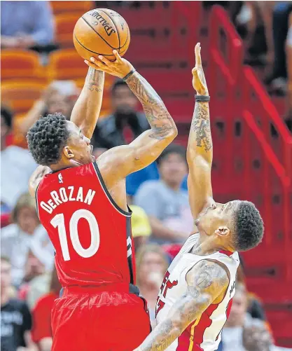  ??  ?? The Raptors guard DeMar DeRozan shoots past the Heat’s Rodney McGruder.
