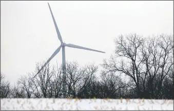  ??  ?? Luther College’s wind turbine generates power in Decorah.