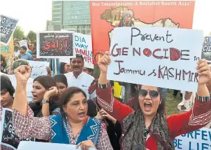  ?? ARIF ALI AFP/GETTY IMAGES ?? Pakistani activists shout slogans during a protest rally in Lahore as they condemn India for stripping Kashmir of its special autonomy and imposing a lockdown.