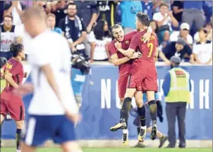  ?? DON EMMERT/AFP ?? Roma’s Marco Tumminello (second right) celebrates scoring the winner against Spurs in their Internatio­nal Champions Cup match in New Jersey on Tuesday.