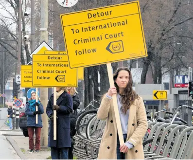  ?? ?? Demonstrat­ors protest against Israel’s President Isaac Herzog attending the opening of the new National Holocaust Museum in Amsterdam, Netherland­s, on Sunday, March 10.