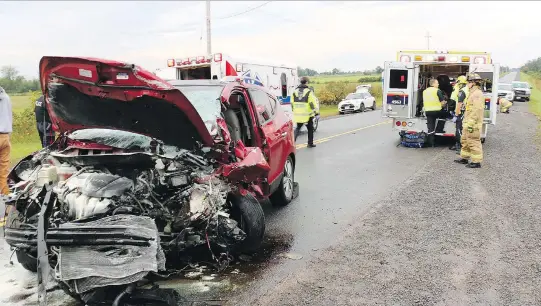  ??  ?? Paramedics and firefighte­rs arrive at the scene of a fatal car crash Thursday on Dalmeny Road, southwest of Metcalfe. Two women, aged 40 and 67, were killed, and three people were injured.