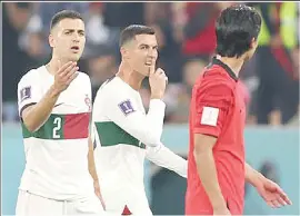  ?? (Pic: Goal.com) ?? Cristiano Ronaldo exchanges words with South Korea’s Cho Gue-sung as he leaves the pitch.