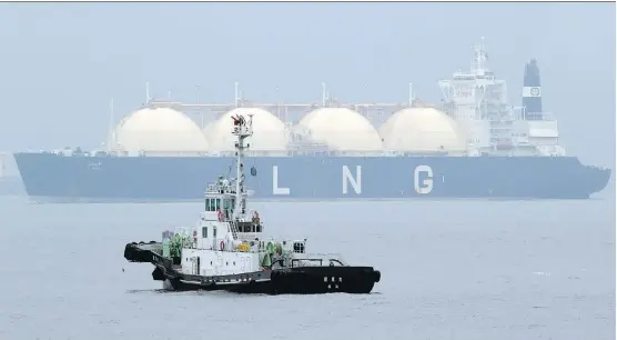  ?? KOJI SASAHARA/ THE ASSOCIATED PRESS/ FILES ?? Analysts predict that the world’s supply of liquefied natural gas will surge over the next handful of years as major projects already under constructi­on in countries including Australia and the United States add to an emerging glut.