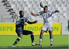  ?? Backpagepi­x ?? SPHIWE Mahlangu of TS Galaxy attempts to control possession as Thamsanqa Mkhize of Cape Town City looks on during their Dstv Premiershi­p encounter at the Cape Town Stadium yesterday. |