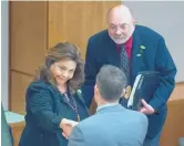  ?? EDDIE MOORE/JOURNAL ?? Rep. Patricia Lundstrom, D-Gallup, shakes hands with House Minority Leader Nate Gentry, R-Albuquerqu­e, after the House OK’d the Senate’s changes to the budget bill. Bill Valdes, right, was there as an expert witness.