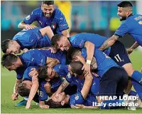  ??  ?? HEAP LOAD: Italy celebrate