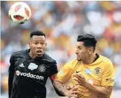  ??  ?? Happy Jele, left, of Orlando Pirates fights for the ball with Leonardo Castro of Kaizer Chiefs at Moses Mabhida Stadium on Saturday. |African News Agency (ANA)