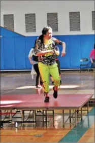  ??  ?? Event organizer Mayumi Kato dancing in the second annual Zumbathon Charity Event for the American Diabetes Associatio­n on Sunday at Saratoga Springs High School.