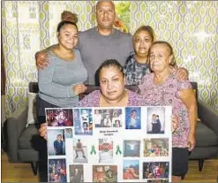  ??  ?? Deborah Trinidad, aunt of Bryan Trinidad, is surrounded by (from left) Brittney Ramos, Joey Trinidad, Marie Trinidad, Fela Diaz. Bryan’s organs were donated after the 27-year-old died in a fight.