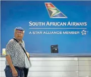  ?? /Reuters ?? Up in the air: A passenger waits to be served at the SAA customer desk, at OR Tambo Internatio­nal Airport on Tuesday.