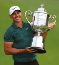  ??  ?? Koepka with the Wanamaker trophy after winning the 2018 PGA Championsh­ip