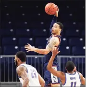  ?? DePaul Athletics / Contribute­d Photo ?? UConn’s Tyrese Martin handles the ball during a game against DePaul in Chicago in January.