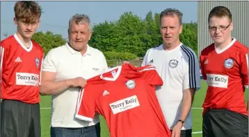  ??  ?? Terry Kelly presents anew set of jerseys to Brian McGuinness, manager of the Dundalk Schoolboys League Gothia Cup team with players Terence Kelly (Quay Celtic) and Jordan Traynor (Redeemer). The Gothia Cup squad will travel to Sweden for the week-long...