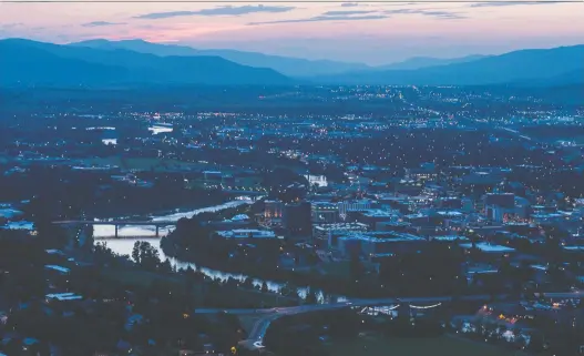  ?? BRANDON HARDER ?? A view of the city of Missoula, Mont. The state started Phase 1 of an ambitious reopen plan that saw churches, retail shops beauty salons and more to resume activities.