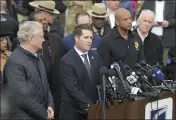  ?? STEVE RUARK — THE ASSOCIATED PRESS ?? From left, Sen. Chris Van Hollen (D-Md.), Bill DelBagno,
FBI special agent in charge of the Baltimore field office, Maryland Gov. Wes Moore and Paul J. Wiedefeld, Maryland's transporta­tion secretary, hold a news conference near the scene where a container ship collided with a support on the Francis Scott Key Bridge, Tuesday, in Baltimore.