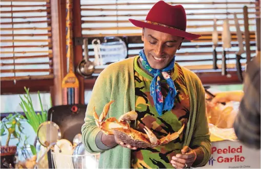  ?? COURTESY OF SUZI PRATT ?? Chef Marcus Samuelsson prepares a crab for a Philippine dish as part of the series “No Passport Required.”