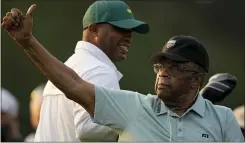  ?? CHARLIE RIEDEL — THE ASSOCIATED PRESS ?? Lee Elder gestures as he arrives for the ceremonial tee shots before the first round of the Masters on Thursday.