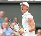  ?? GETTY IMAGES ?? Kevin Anderson, a former Big Ten star at Illinois, celebrates during his 7-6 (6), 6-7 (5), 6-7 (9), 6-4, 26-24 victory over John Isner.