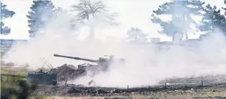  ?? BULENT KILIC, AFP/ GETTY IMAGES ?? ATurkish army cannon shoots toward Syria in Kilis, in south- central Turkey, onMonday. Turkey has said itmay send ground troops.