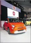  ??  ?? Several all- electric cars debuted at the L. A. show, including the Fiat 500. Called the 500e, it is more aerodynami­c than other 500s.