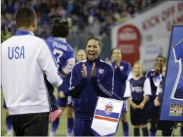  ?? THE ASSOCIATED PRESS — 2015 ?? Shannon Boxx, right, is greeted by her husband, Aaron Spearman, and their daughter, Zoe Spearman, before a friendly match that was the last of Boxx’s career.