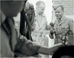  ??  ?? LEFT C Pakeman of Jamaica interviewe­d on the passing out parade for West Indian volunteers