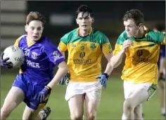  ??  ?? Conor Twomey of Gusserane tries to break away from James O’Leary and Mikey Cullen (Our Lady’s Island/St. Fintan’s).