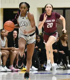  ?? (Pine Bluff Commercial/ I.C. Murrell) ?? Zaay Green of UAPB pushes the ball in transition against Chynell Mitchell of Alabama A&M in the second quarter on Jan. 6, at H.O. Clemmons Arena.