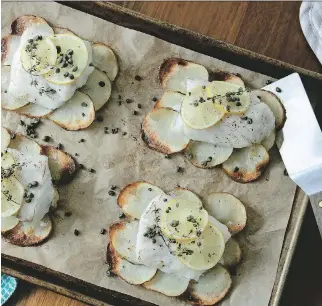  ?? MO L LY G I L B E RT. ?? Lemon- Herb Sole on Crispy Potato Rafts are served hot and crisp, making the rafts contrast well with the tender fish resting on top of them.