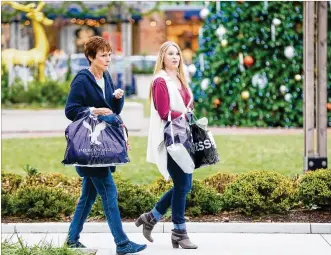  ?? GREG LYNCH/STAFF 2016 ?? Joyce Poe of Liberty Twp. and Allie Gartner of Harrison walk through Liberty Center as they shop on Black Friday in 2016. This year could be the highest grossing winter shopping season yet.