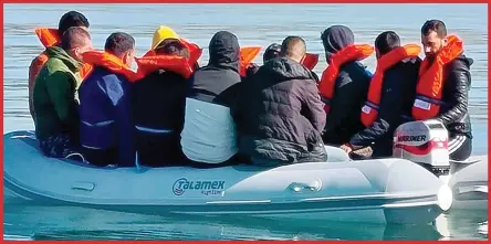  ??  ?? Packed: An overcrowde­d grey Talamex dinghy used by a group of migrants aiming to reach Hythe Range beach in Kent last week is now seen stacked up in a pile at the secluded warehouse